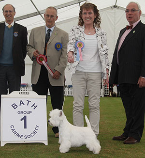 Miss M Burns & Mrs A Burns Burneze Geordie Girl with puppy group judge Mr B W Reynolds-Frost, Mr W Browne-Cole (Chairman) & Mr C J Laurence -President